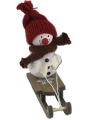 Snowman white on a sledge, scarf and knitted cap, H 11 cm, for candlerings