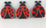 Wooden ladybug with red wings, embedded black flowers, hand-painted, h 9 cm